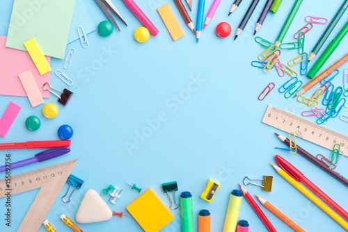 Office supplies on the blue background table