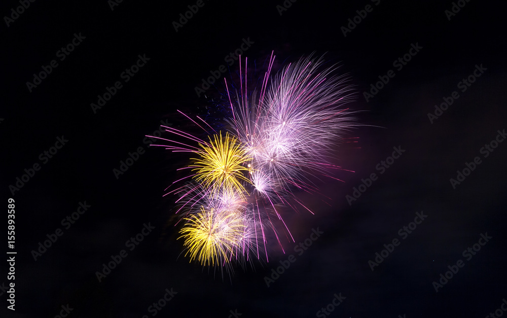 Fireworks light up close-up against dark sky Fireworks light up close-up against dark sky