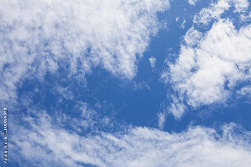 White fluffy clouds in the blue sky.