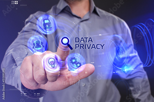 Business, Technology, Internet and network concept. Young businessman working on a virtual screen of the future and sees the inscription: Data privacy