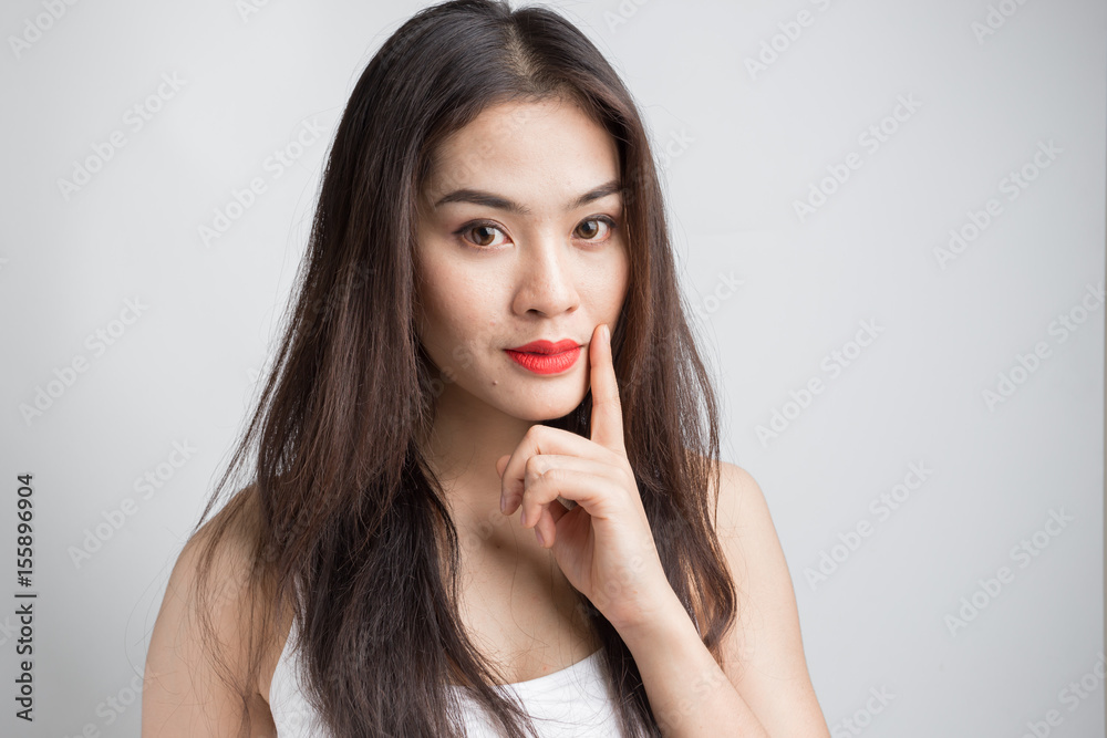 Young Asian woman with doubtful emotion. Young Asian woman with doubtful emotion.