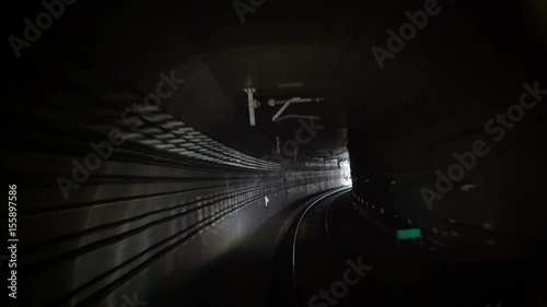 Out of the Tunnel. New Hope.
Subway tunnel view as seen from a forward moving train. Train goes out of the tunnel. 
