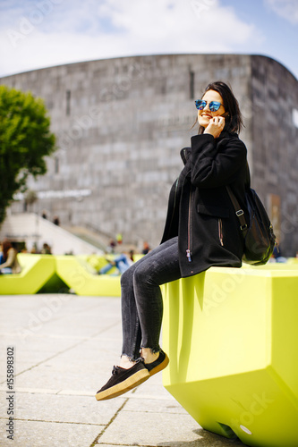 Young woman sitting in the ...