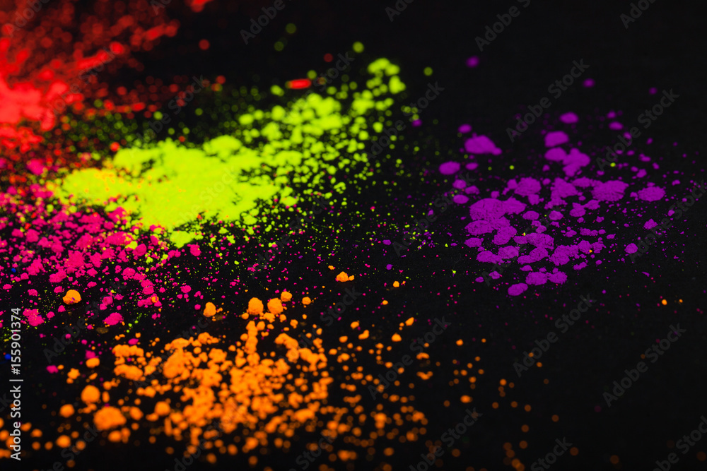 Face powder on a black background, abstract