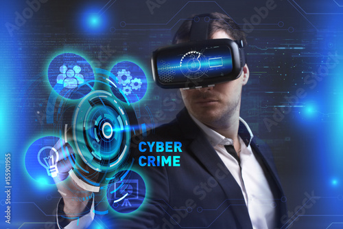Business, Technology, Internet and network concept. Young businessman working in virtual reality glasses sees the inscription: Cyber crime