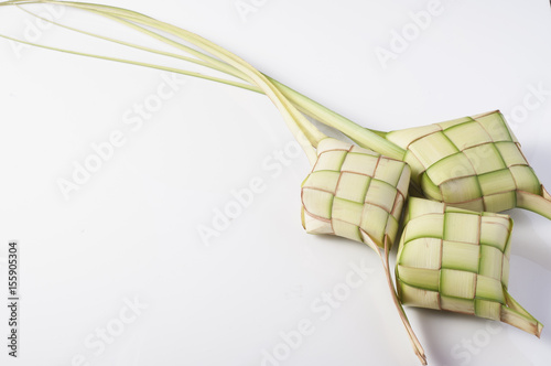 Ketupat (Rice Dumpling) On White Background. Ketupat is a natural rice casing made from young coconut leaves for cooking rice during eid Mubarak