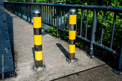 Stainless pole on sidewalk