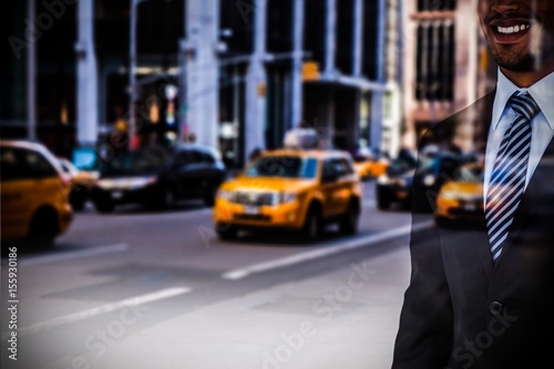 Composite image of mid section of smiling businessman standing 