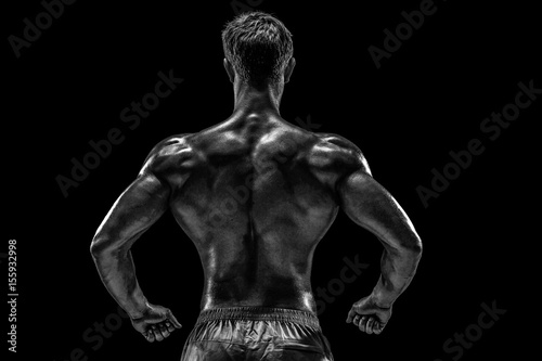 Strong Athletic Man Fitness Model posing back muscles, triceps o