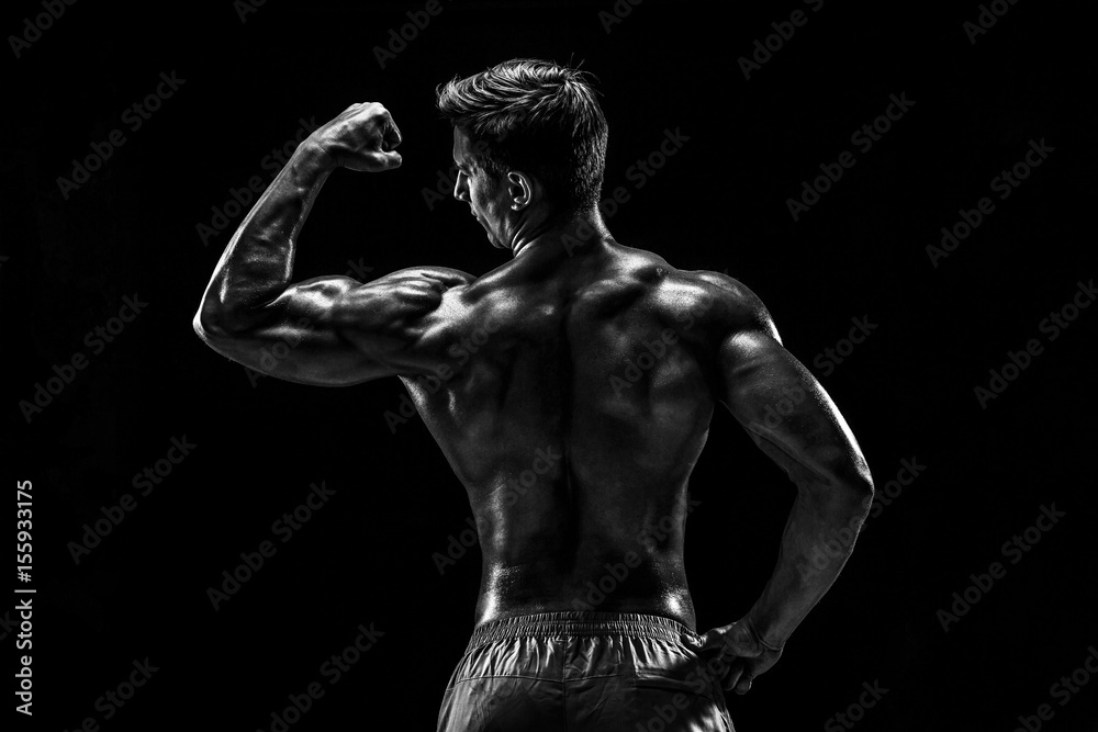 Strong Athletic Man Fitness Model posing back muscles, triceps o