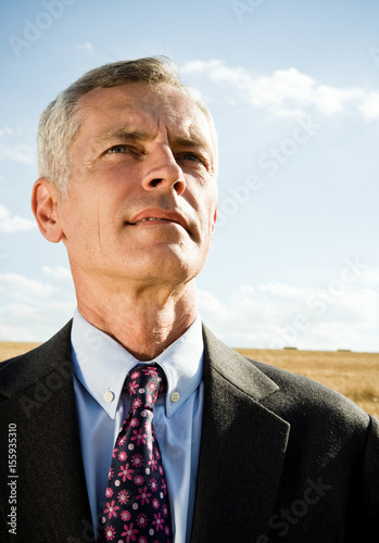 Businessman in a wheat field. photo