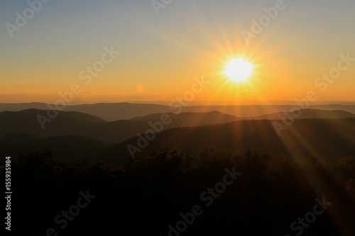 Orange sunset over the appalachian mountains. © Eric