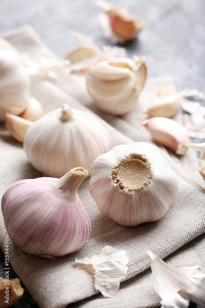 Garlic on the grey wooden table Garlic on the grey wooden table