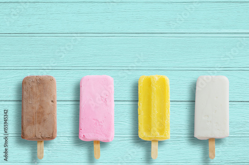 Ice cream stick put on wood background with copy space.