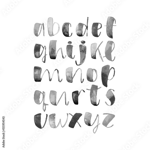 Hand drawn alphabet written with brush pen in monochrome black and white colors. Cursive letters. Watercolor alphabet very fresh and modern style lettering.
