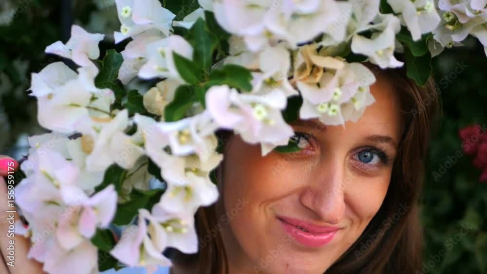 Beautiful girl hiding behind the bush Beautiful girl hiding behind the bush