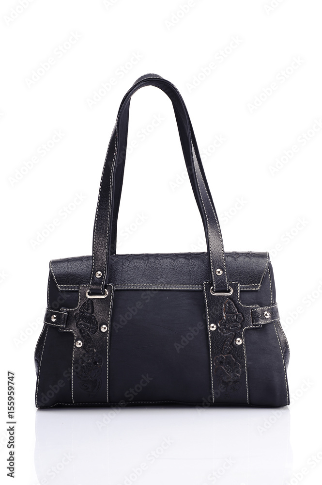 Leather ladies bag on a white background. Beautiful, fashionable, accessory, isolated. Interesting design, the texture of the skin. Comfortable handle.