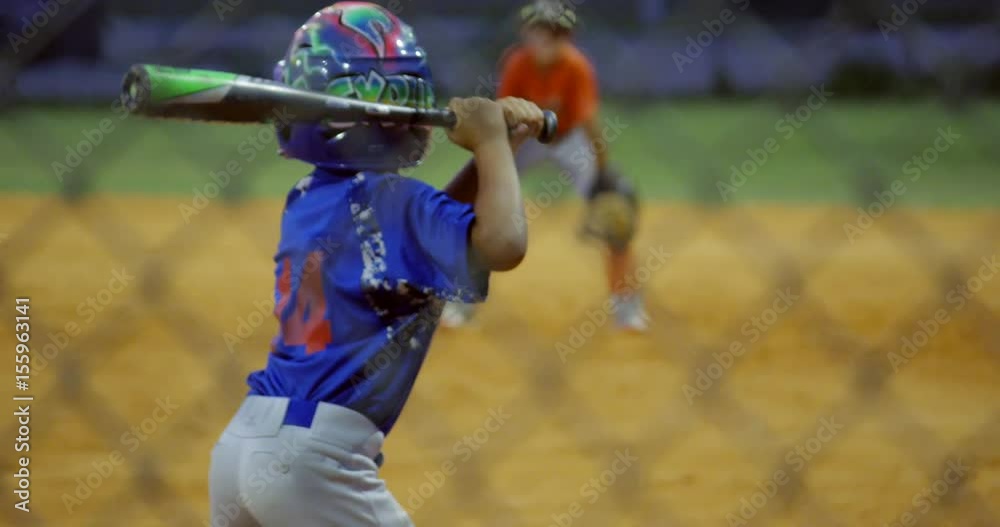 Slow motion of kid batting and running during baseball game Stock ビデオ