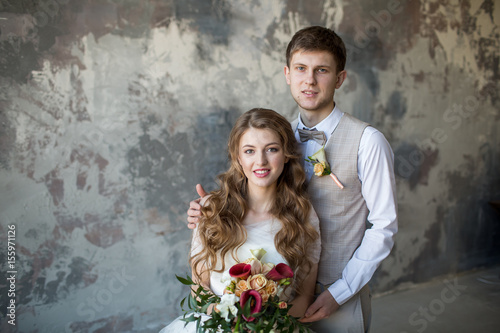 Portrait of a wedding couple in a loft room