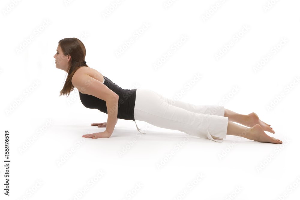 Studio shot over a white background of a healthy, attractive young woman practicing yoga exercise.