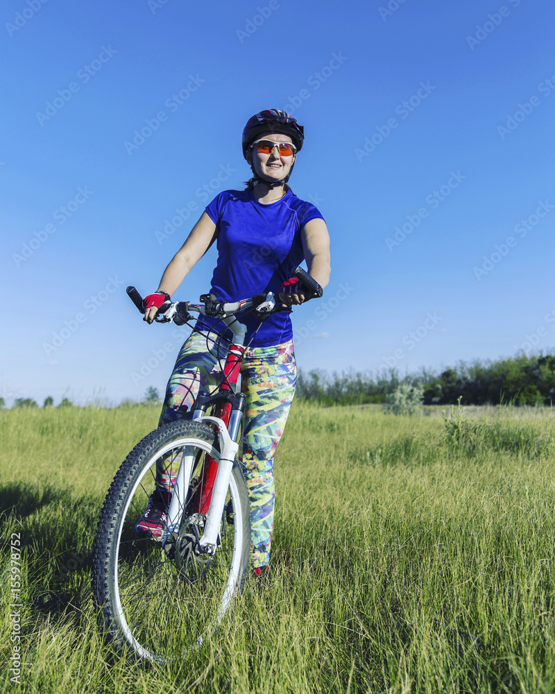 Young Woman Riding Mountain Bike in Wilderness.