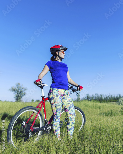 Young Woman Riding Mountain Bike in Wilderness.