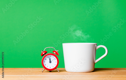 cup of coffee and alarm clock