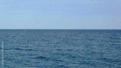 static shot of surface of mediterranean sea, clear blue sky
