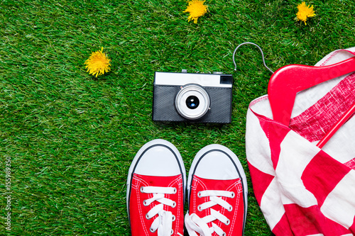 gumshoes, jacket on hanger and camera photo