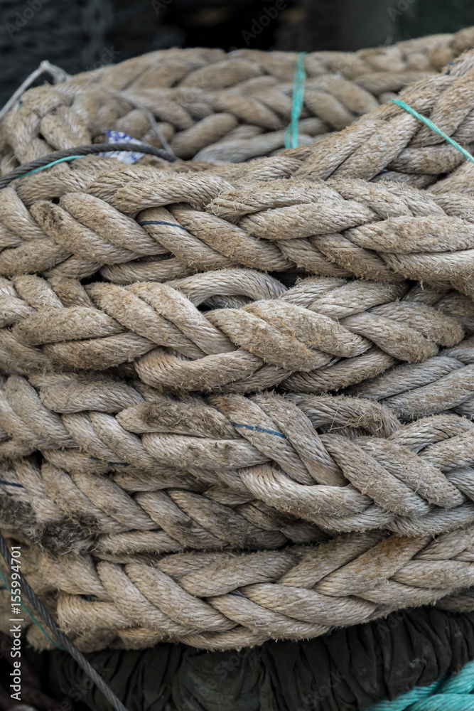 Closeup view to stacked and knotted old rope