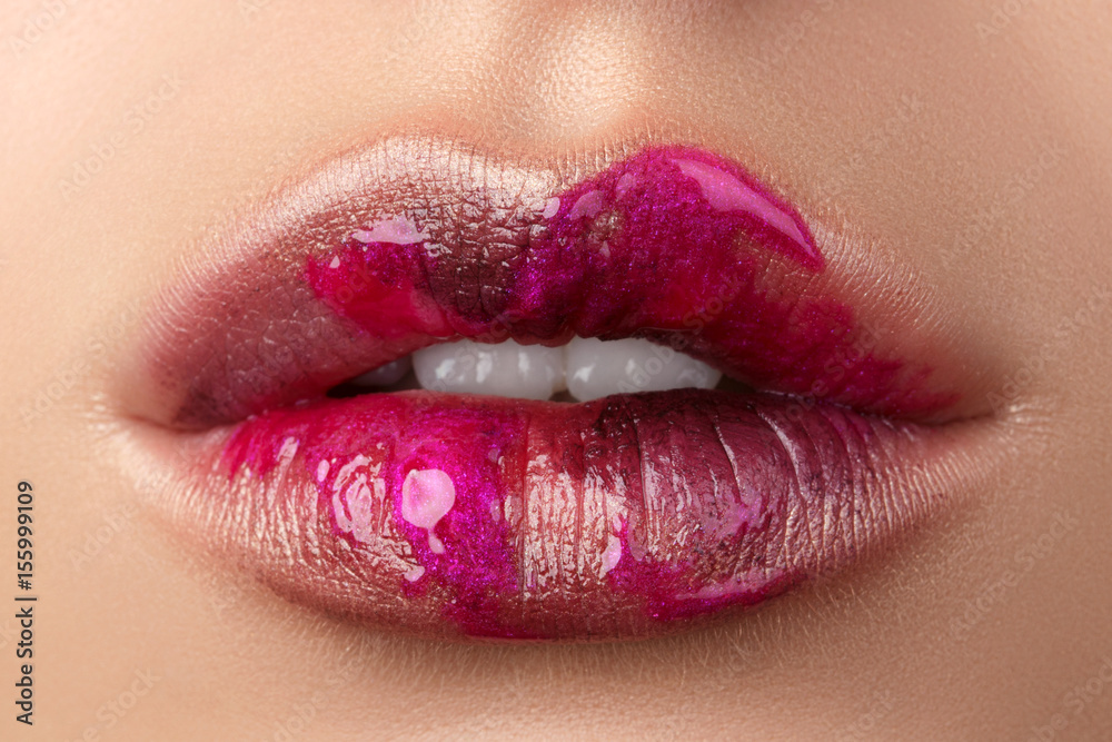 Close up view of beautiful woman lips with modern fashion make up Close up view of beautiful woman lips with modern fashion make up