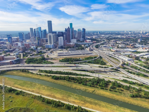 Aerial view Downtown with Interstate 10, 45 and Gulf freeway intersection. Massive highway, stack interchange, viaduct and elevated road junction overpass from Northeast side of Houston, Texas, USA. photo