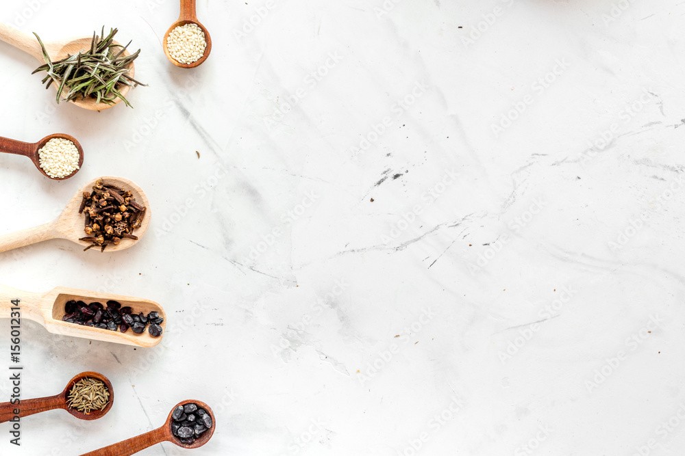 Dry colorful spices, vanilla, cinnamon on kitchen stone table background top view mockup Dry colorful spices, vanilla, cinnamon on kitchen stone table background top view mockup
