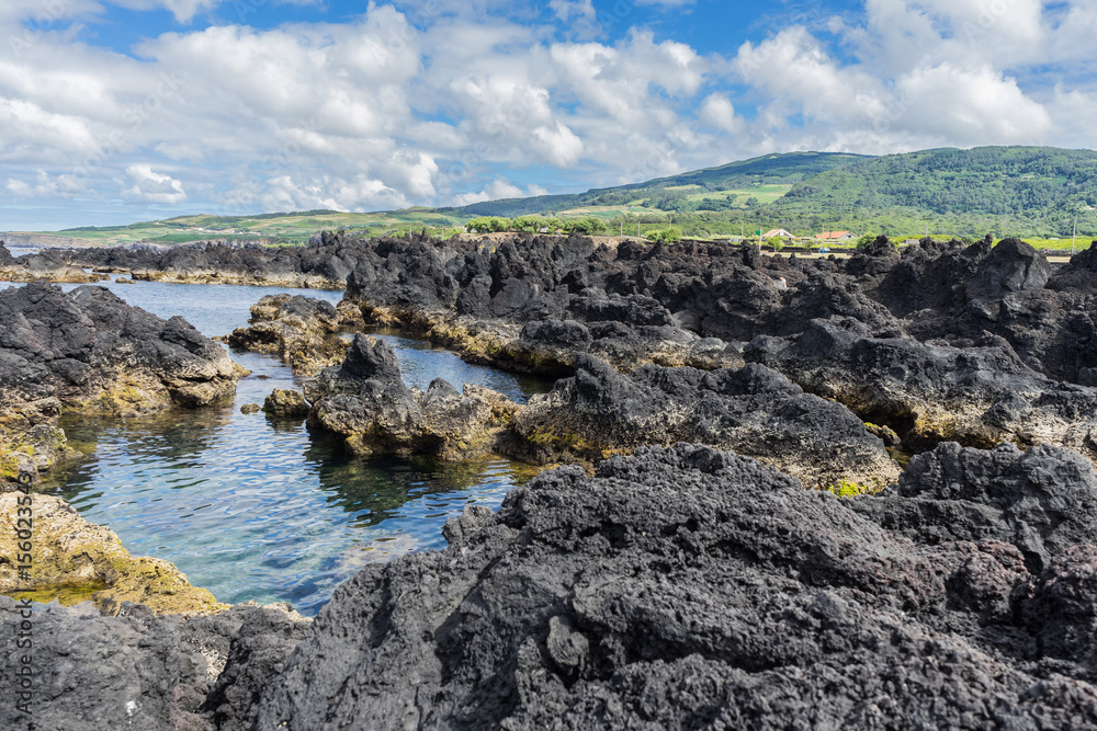 Seascape with black lava rocks and natural swimming pools in Biscoitos, Terceira, Azores, Portugal