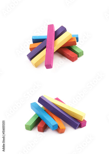 Pile of rainbow colored chalks isolated