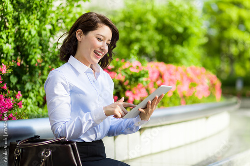 woman holding tablet PC