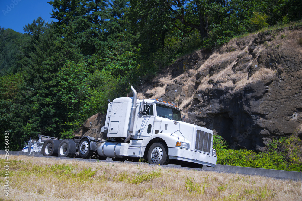 Big rig classic semi truck flat bed trailer green highway Big rig classic semi truck flat bed trailer green highway