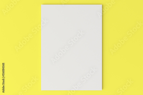 Blank white closed brochure mock-up on yellow background