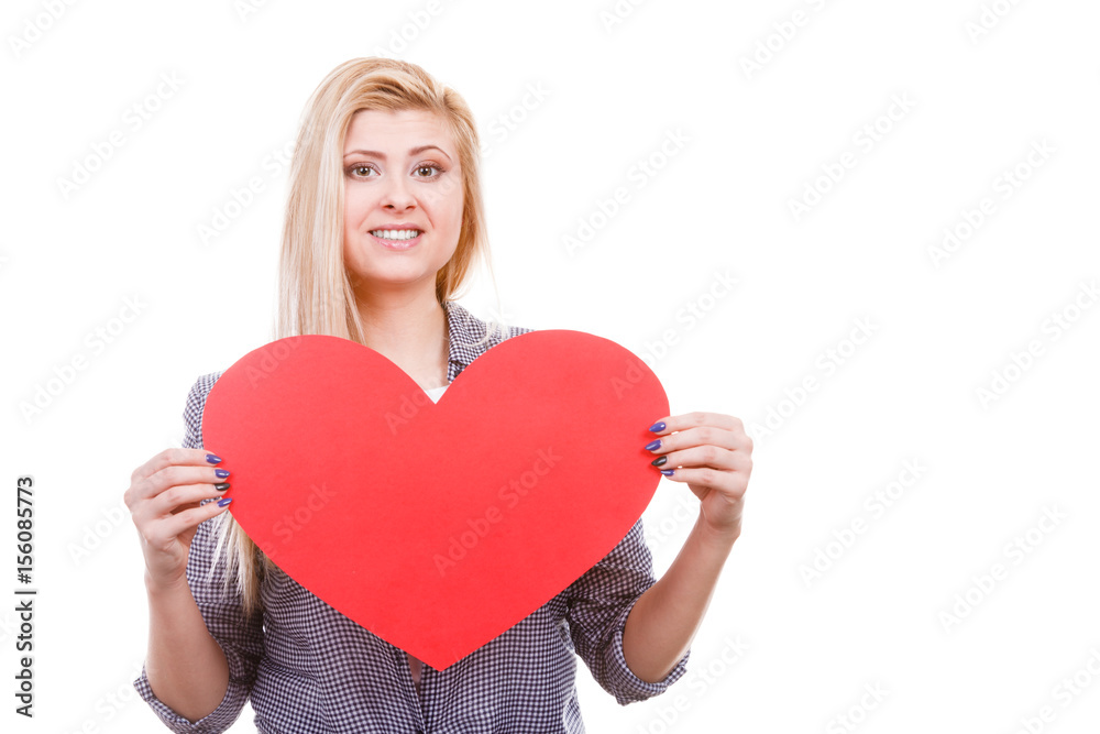 Woman holding big heart love symbol Woman holding big heart love symbol