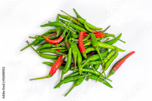 Green and red thai chilli on white background