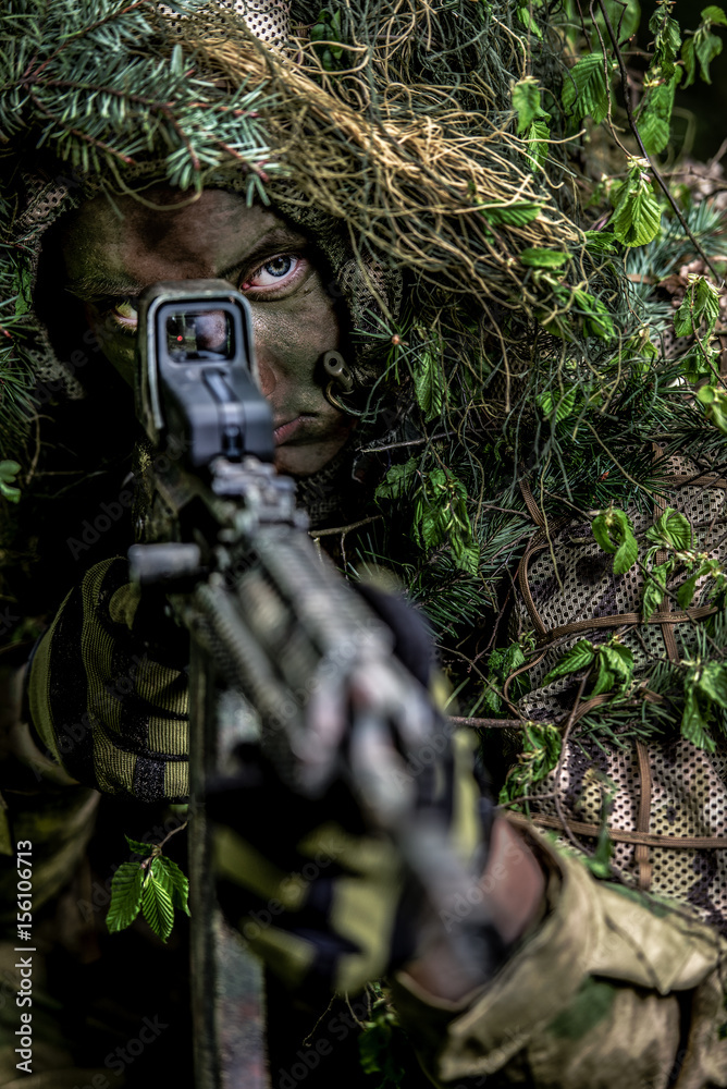 Fototapeta premium Camouflaged soldiers in forest