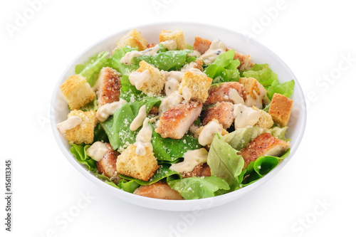 Caesar salad on white background.