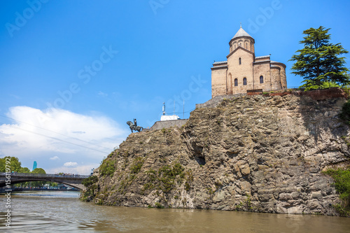 Metekhi church and Houses on the edge of a cliff above the river Kura. Tbilisi, the historic city center © k_samurkas