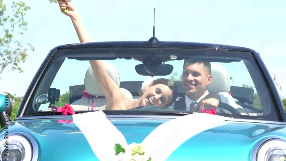 Just married couple driving convertible car Just married couple driving convertible car