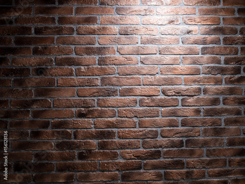 Dark brown brick wall.