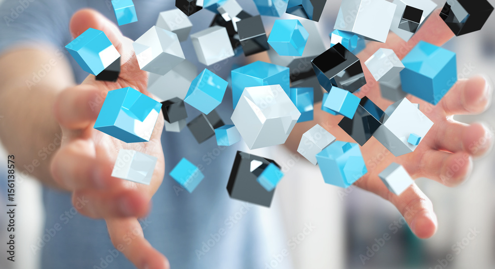 Businessman holding floating blue shiny cube network 3D rendering Businessman holding floating blue shiny cube network 3D rendering