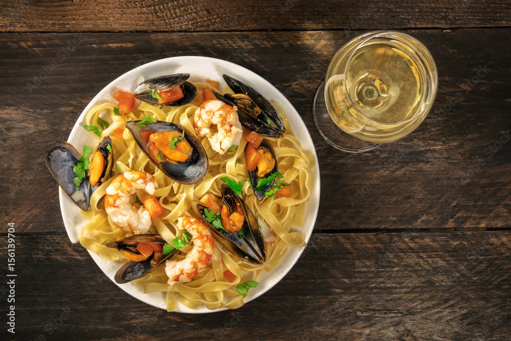 Seafood pasta with mussels, shrimps, and white wine Seafood pasta with mussels, shrimps, and white wine