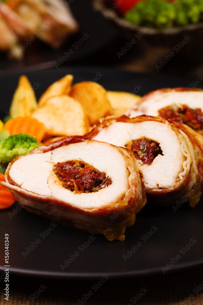 Delicious chicken rolls with dried tomatoes and mozzarella. Delicious chicken rolls with dried tomatoes and mozzarella.