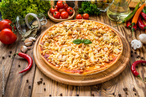 delicious italia pizza in a restaurant, on the wooden desk