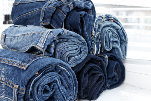 torn jeans stack background blue denim fashion beauty